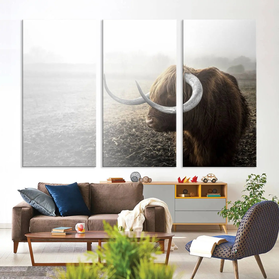 A captivating Cow Wall Art Canvas Print featuring a Highland cow with impressive horns in a misty field, crafted on museum-quality canvas. Its UV-protective coating preserves the artwork's vibrant colors.