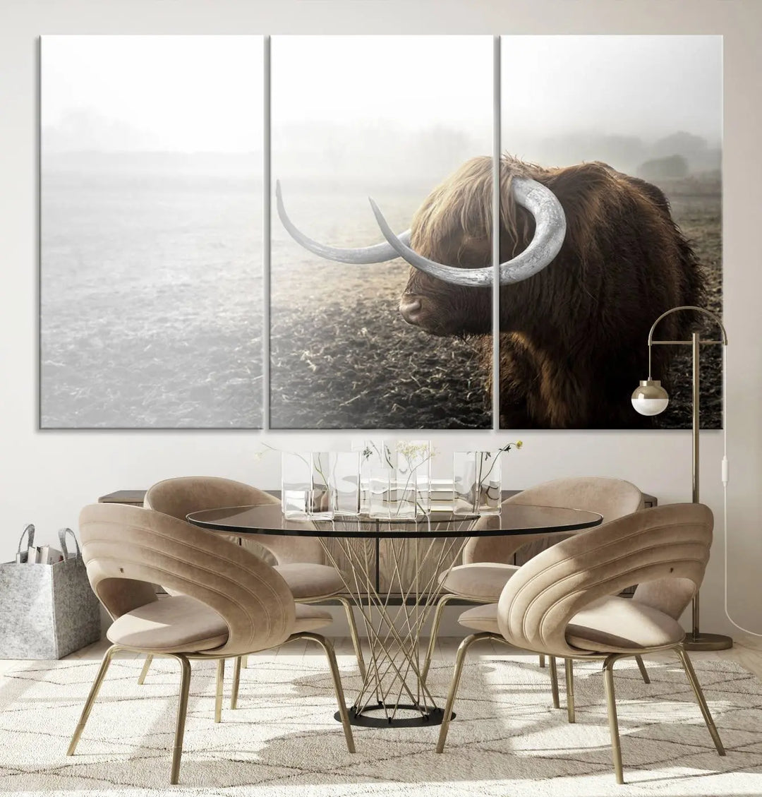 A captivating Cow Wall Art Canvas Print featuring a Highland cow with impressive horns in a misty field, crafted on museum-quality canvas. Its UV-protective coating preserves the artwork's vibrant colors.