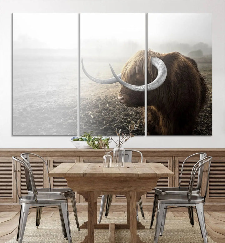 A captivating Cow Wall Art Canvas Print featuring a Highland cow with impressive horns in a misty field, crafted on museum-quality canvas. Its UV-protective coating preserves the artwork's vibrant colors.