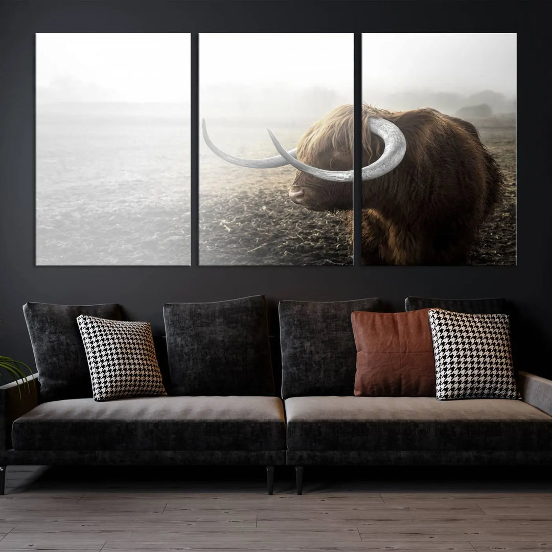 A captivating Cow Wall Art Canvas Print featuring a Highland cow with impressive horns in a misty field, crafted on museum-quality canvas. Its UV-protective coating preserves the artwork's vibrant colors.