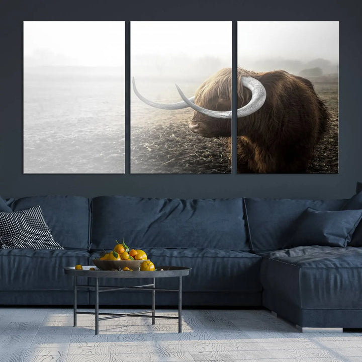 A captivating Cow Wall Art Canvas Print featuring a Highland cow with impressive horns in a misty field, crafted on museum-quality canvas. Its UV-protective coating preserves the artwork's vibrant colors.