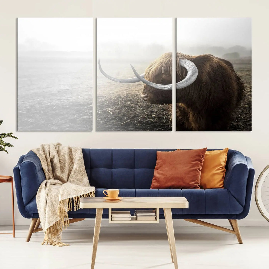 A captivating Cow Wall Art Canvas Print featuring a Highland cow with impressive horns in a misty field, crafted on museum-quality canvas. Its UV-protective coating preserves the artwork's vibrant colors.