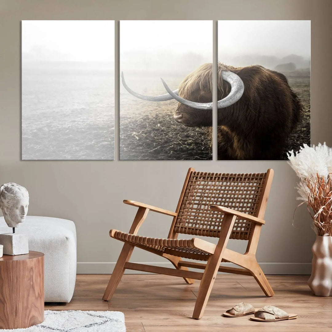 A captivating Cow Wall Art Canvas Print featuring a Highland cow with impressive horns in a misty field, crafted on museum-quality canvas. Its UV-protective coating preserves the artwork's vibrant colors.