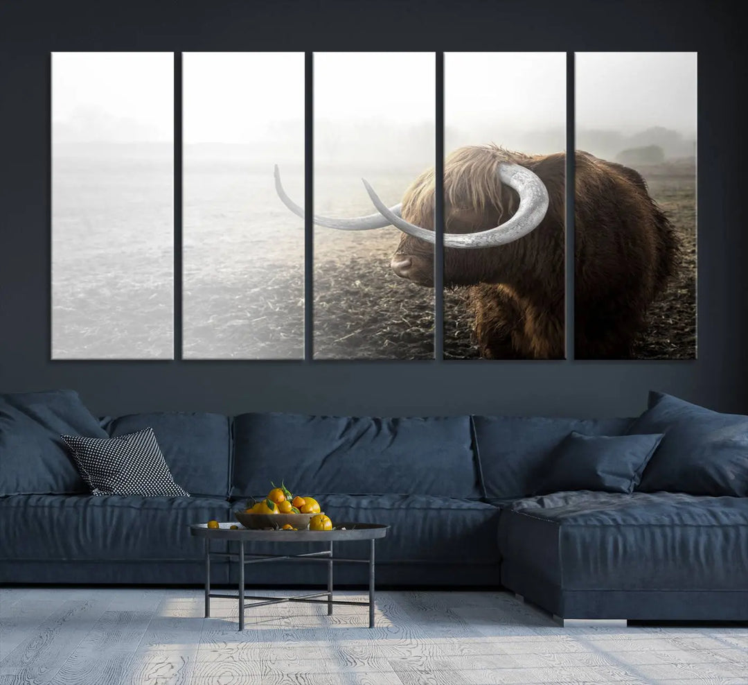 A captivating Cow Wall Art Canvas Print featuring a Highland cow with impressive horns in a misty field, crafted on museum-quality canvas. Its UV-protective coating preserves the artwork's vibrant colors.