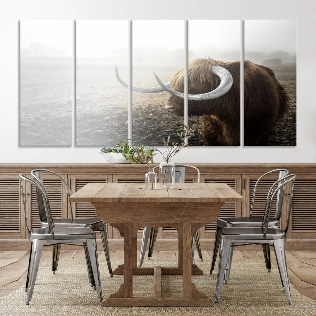 A captivating Cow Wall Art Canvas Print featuring a Highland cow with impressive horns in a misty field, crafted on museum-quality canvas. Its UV-protective coating preserves the artwork's vibrant colors.