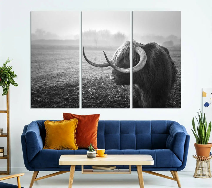 The living room features a three-panel wall art of a highland cow in a foggy field, using the Cow Wall Art Canvas Print for visual impact. This museum-quality canvas includes UV-protective coating to ensure longevity.