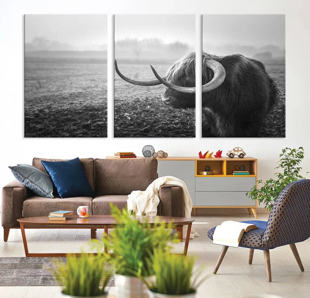 The living room features a three-panel wall art of a highland cow in a foggy field, using the Cow Wall Art Canvas Print for visual impact. This museum-quality canvas includes UV-protective coating to ensure longevity.