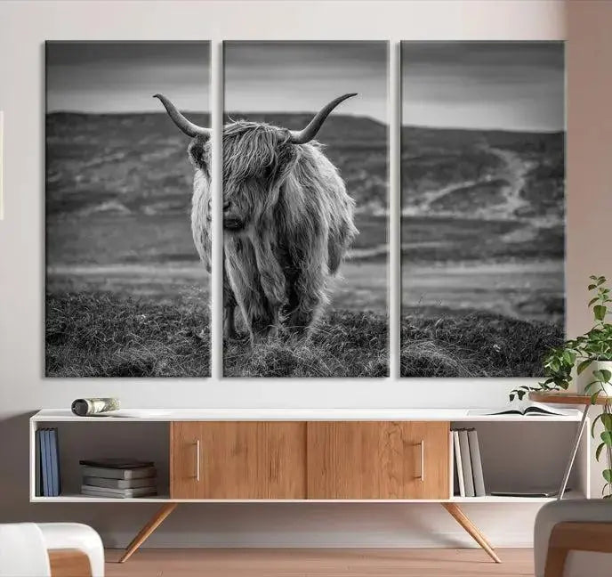 Cow Wall Art Canvas Print featuring a Highland cow in a black and white landscape on museum-quality canvas. A UV-protective coating preserves its pristine condition for years to come.