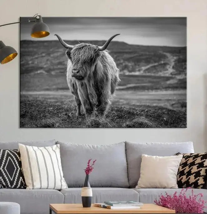 Cow Wall Art Canvas Print featuring a Highland cow in a black and white landscape on museum-quality canvas. A UV-protective coating preserves its pristine condition for years to come.