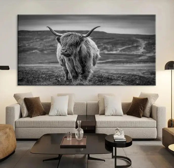 Cow Wall Art Canvas Print featuring a Highland cow in a black and white landscape on museum-quality canvas. A UV-protective coating preserves its pristine condition for years to come.