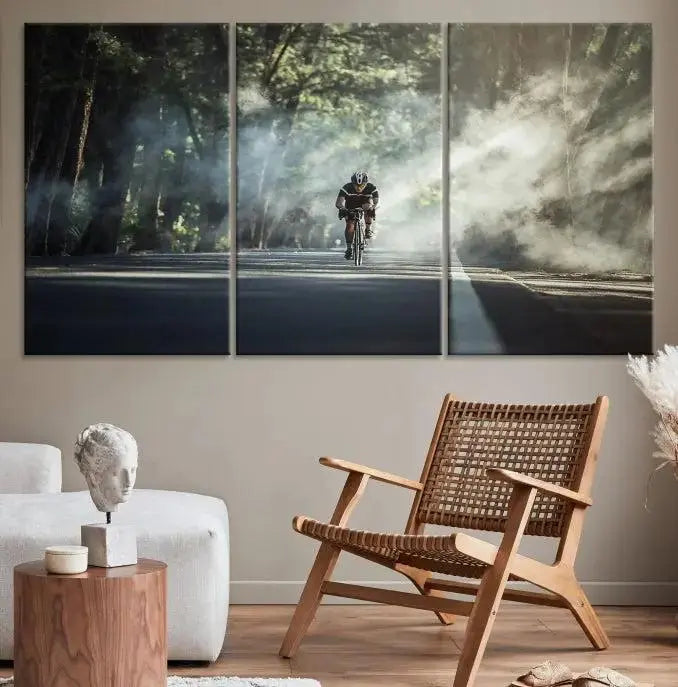 A cyclist rides through a misty forest in the "Cycling Road Bike in the Morning" artwork, divided into three panels on gallery-wrapped, museum-quality canvas.