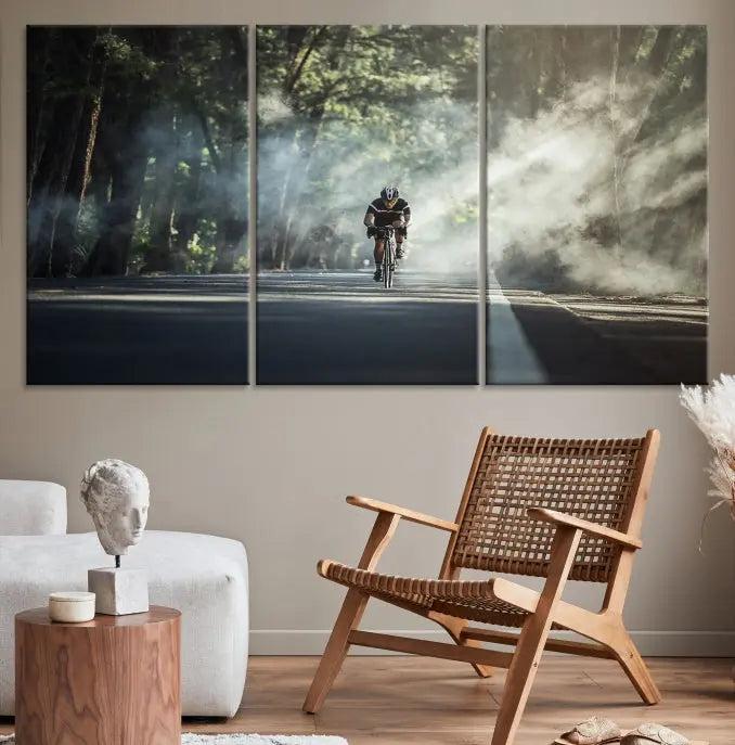 A cyclist rides through a misty forest in the "Cycling Road Bike in the Morning" artwork, divided into three panels on gallery-wrapped, museum-quality canvas.