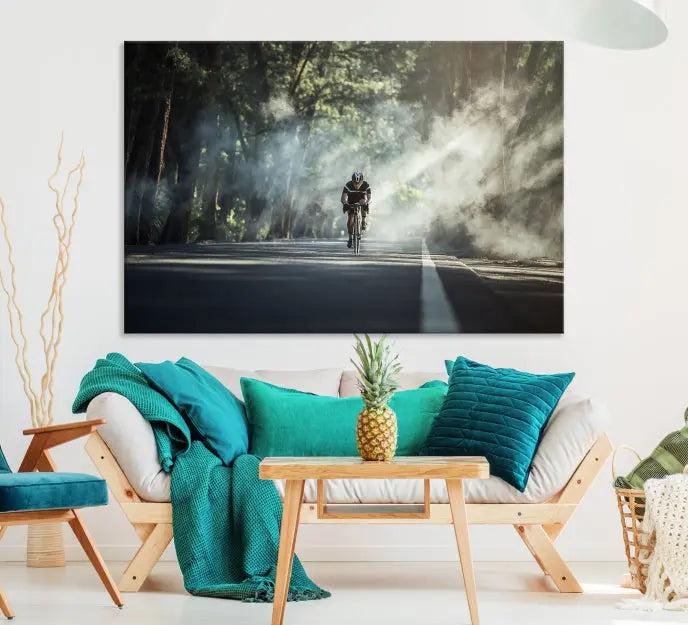 A cyclist rides through a misty forest in the "Cycling Road Bike in the Morning" artwork, divided into three panels on gallery-wrapped, museum-quality canvas.