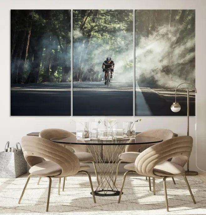 A cyclist rides through a misty forest in the "Cycling Road Bike in the Morning" artwork, divided into three panels on gallery-wrapped, museum-quality canvas.