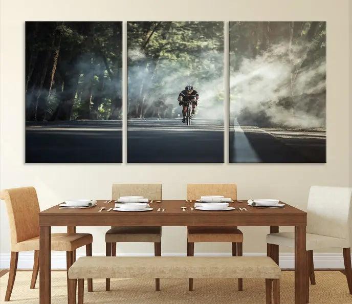 A cyclist rides through a misty forest in the "Cycling Road Bike in the Morning" artwork, divided into three panels on gallery-wrapped, museum-quality canvas.