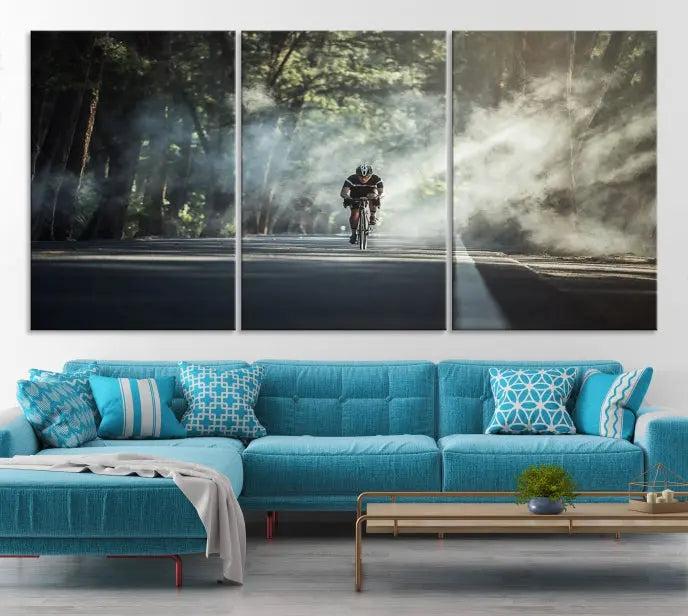 A cyclist rides through a misty forest in the "Cycling Road Bike in the Morning" artwork, divided into three panels on gallery-wrapped, museum-quality canvas.