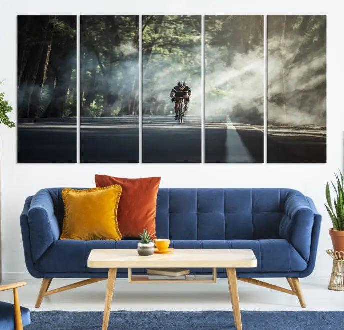 A cyclist rides through a misty forest in the "Cycling Road Bike in the Morning" artwork, divided into three panels on gallery-wrapped, museum-quality canvas.