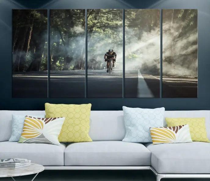 A cyclist rides through a misty forest in the "Cycling Road Bike in the Morning" artwork, divided into three panels on gallery-wrapped, museum-quality canvas.