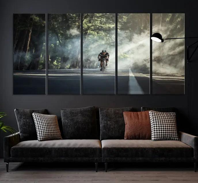 A cyclist rides through a misty forest in the "Cycling Road Bike in the Morning" artwork, divided into three panels on gallery-wrapped, museum-quality canvas.