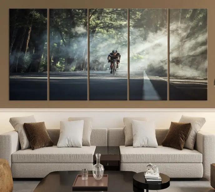 A cyclist rides through a misty forest in the "Cycling Road Bike in the Morning" artwork, divided into three panels on gallery-wrapped, museum-quality canvas.