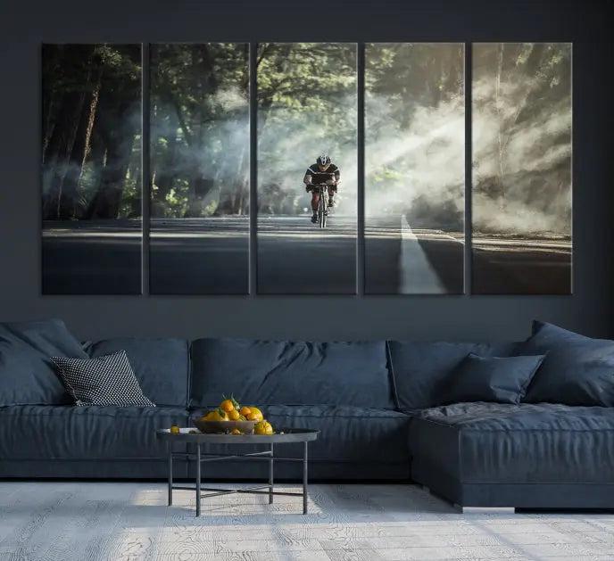 A cyclist rides through a misty forest in the "Cycling Road Bike in the Morning" artwork, divided into three panels on gallery-wrapped, museum-quality canvas.