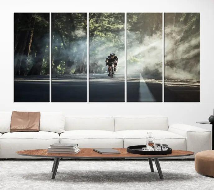 A cyclist rides through a misty forest in the "Cycling Road Bike in the Morning" artwork, divided into three panels on gallery-wrapped, museum-quality canvas.