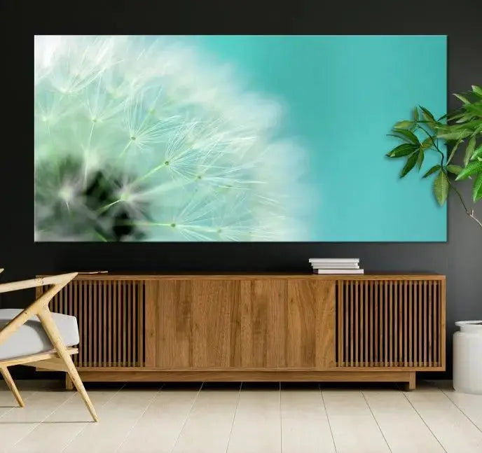 The room is elegantly enhanced by the DANDELION Flower Wall Art Canvas Print, showcasing a close-up of a dandelion in a triptych format. Printed on museum-quality canvas with UV-protective coating, this piece adds sophistication to any modern living room. Enjoy the added convenience of free shipping.