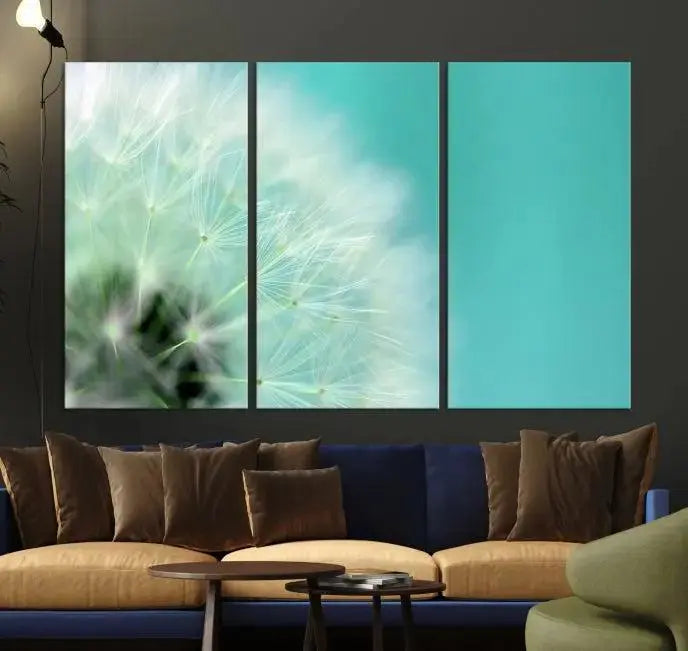 The room is elegantly enhanced by the DANDELION Flower Wall Art Canvas Print, showcasing a close-up of a dandelion in a triptych format. Printed on museum-quality canvas with UV-protective coating, this piece adds sophistication to any modern living room. Enjoy the added convenience of free shipping.