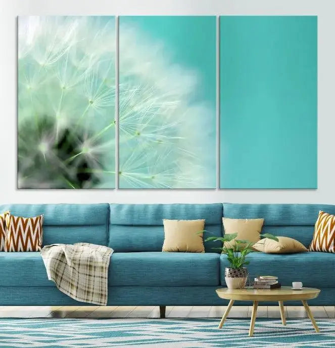 The room is elegantly enhanced by the DANDELION Flower Wall Art Canvas Print, showcasing a close-up of a dandelion in a triptych format. Printed on museum-quality canvas with UV-protective coating, this piece adds sophistication to any modern living room. Enjoy the added convenience of free shipping.