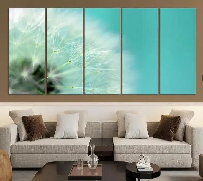 The room is elegantly enhanced by the DANDELION Flower Wall Art Canvas Print, showcasing a close-up of a dandelion in a triptych format. Printed on museum-quality canvas with UV-protective coating, this piece adds sophistication to any modern living room. Enjoy the added convenience of free shipping.