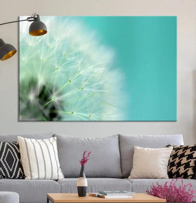 The room is elegantly enhanced by the DANDELION Flower Wall Art Canvas Print, showcasing a close-up of a dandelion in a triptych format. Printed on museum-quality canvas with UV-protective coating, this piece adds sophistication to any modern living room. Enjoy the added convenience of free shipping.