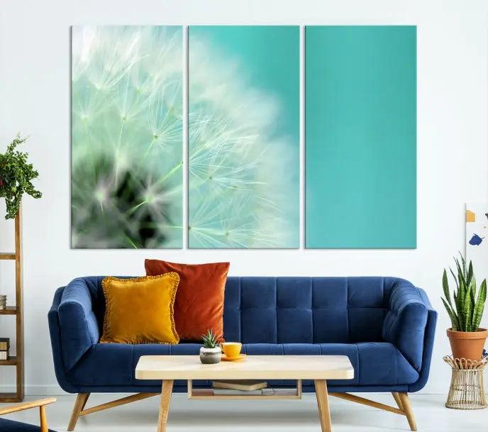 The room is elegantly enhanced by the DANDELION Flower Wall Art Canvas Print, showcasing a close-up of a dandelion in a triptych format. Printed on museum-quality canvas with UV-protective coating, this piece adds sophistication to any modern living room. Enjoy the added convenience of free shipping.