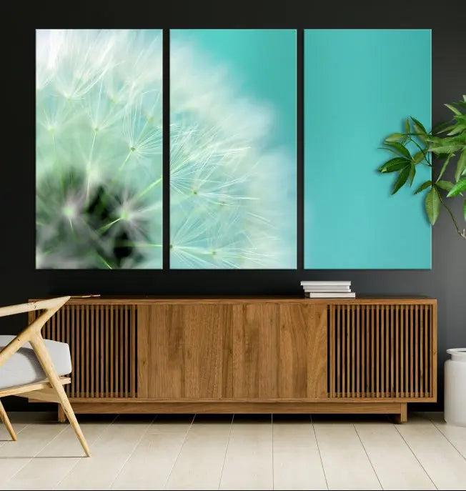 The room is elegantly enhanced by the DANDELION Flower Wall Art Canvas Print, showcasing a close-up of a dandelion in a triptych format. Printed on museum-quality canvas with UV-protective coating, this piece adds sophistication to any modern living room. Enjoy the added convenience of free shipping.