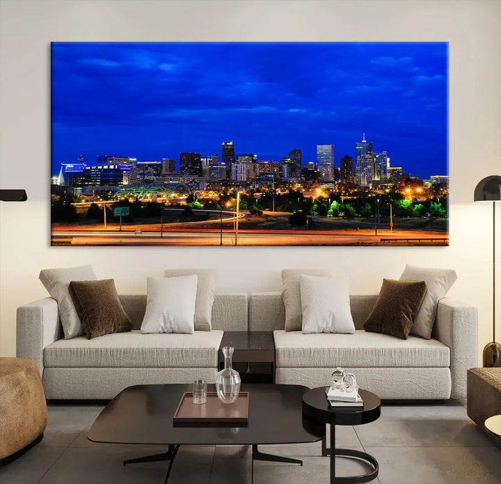 An inviting room features the "Dallas City Lights Night Bright Blue Skyline Cityscape View Wall Art Canvas Print," elegantly suspended and basking in soft lighting.