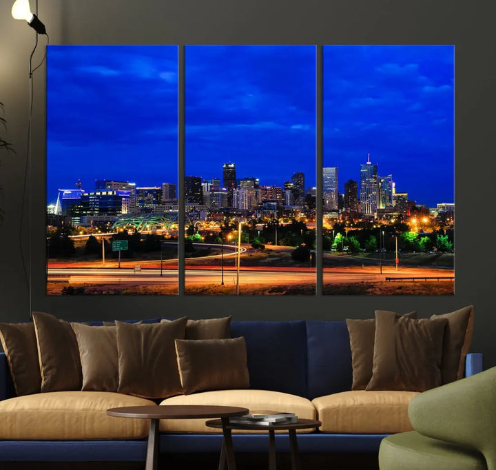 An inviting room features the "Dallas City Lights Night Bright Blue Skyline Cityscape View Wall Art Canvas Print," elegantly suspended and basking in soft lighting.