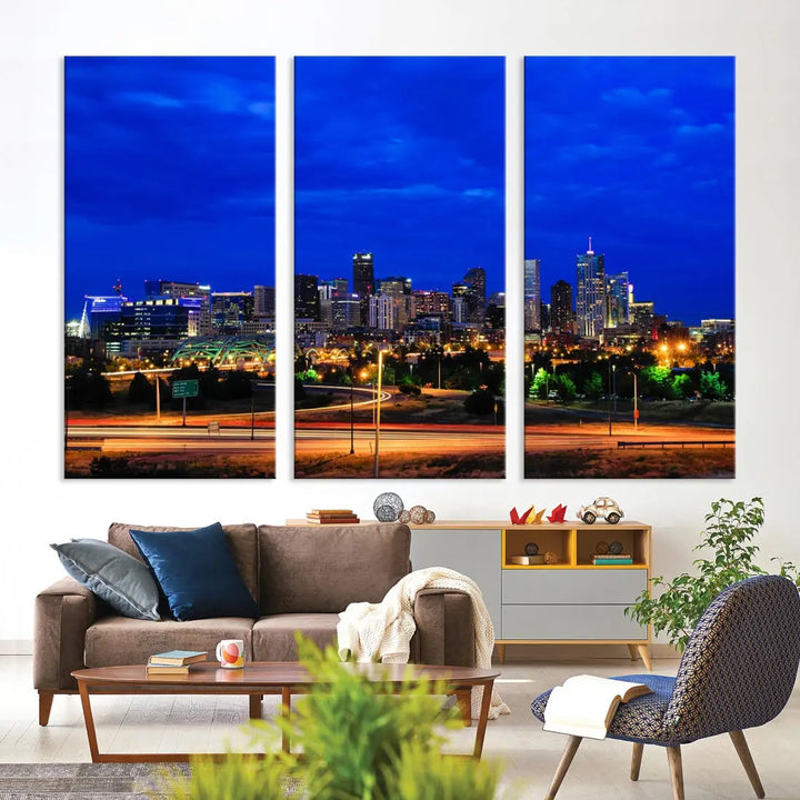 An inviting room features the "Dallas City Lights Night Bright Blue Skyline Cityscape View Wall Art Canvas Print," elegantly suspended and basking in soft lighting.