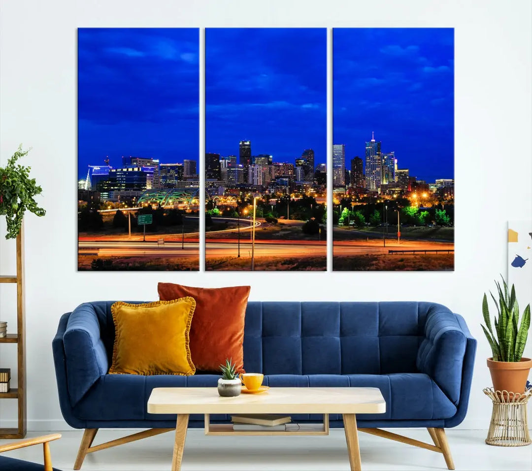 An inviting room features the "Dallas City Lights Night Bright Blue Skyline Cityscape View Wall Art Canvas Print," elegantly suspended and basking in soft lighting.