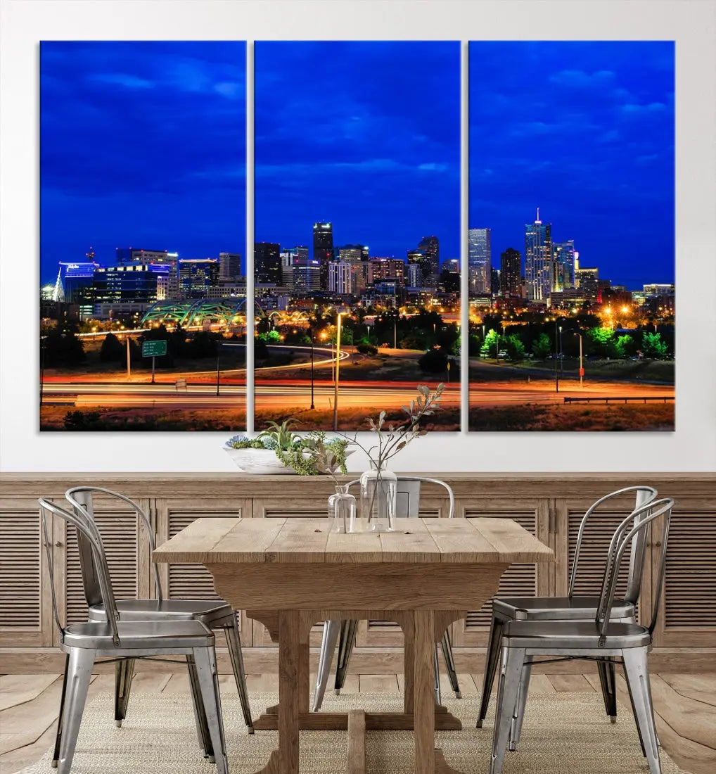 An inviting room features the "Dallas City Lights Night Bright Blue Skyline Cityscape View Wall Art Canvas Print," elegantly suspended and basking in soft lighting.