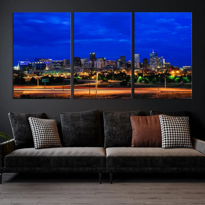 An inviting room features the "Dallas City Lights Night Bright Blue Skyline Cityscape View Wall Art Canvas Print," elegantly suspended and basking in soft lighting.