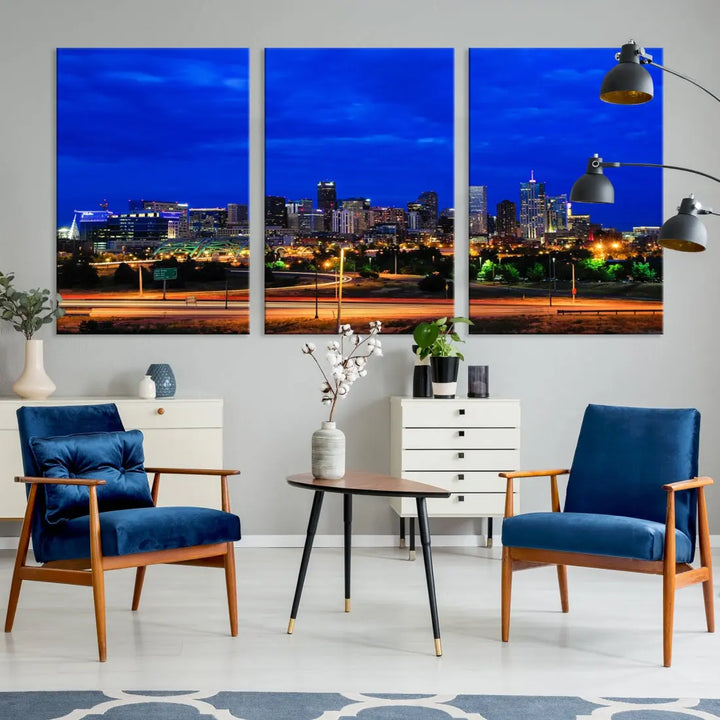 An inviting room features the "Dallas City Lights Night Bright Blue Skyline Cityscape View Wall Art Canvas Print," elegantly suspended and basking in soft lighting.