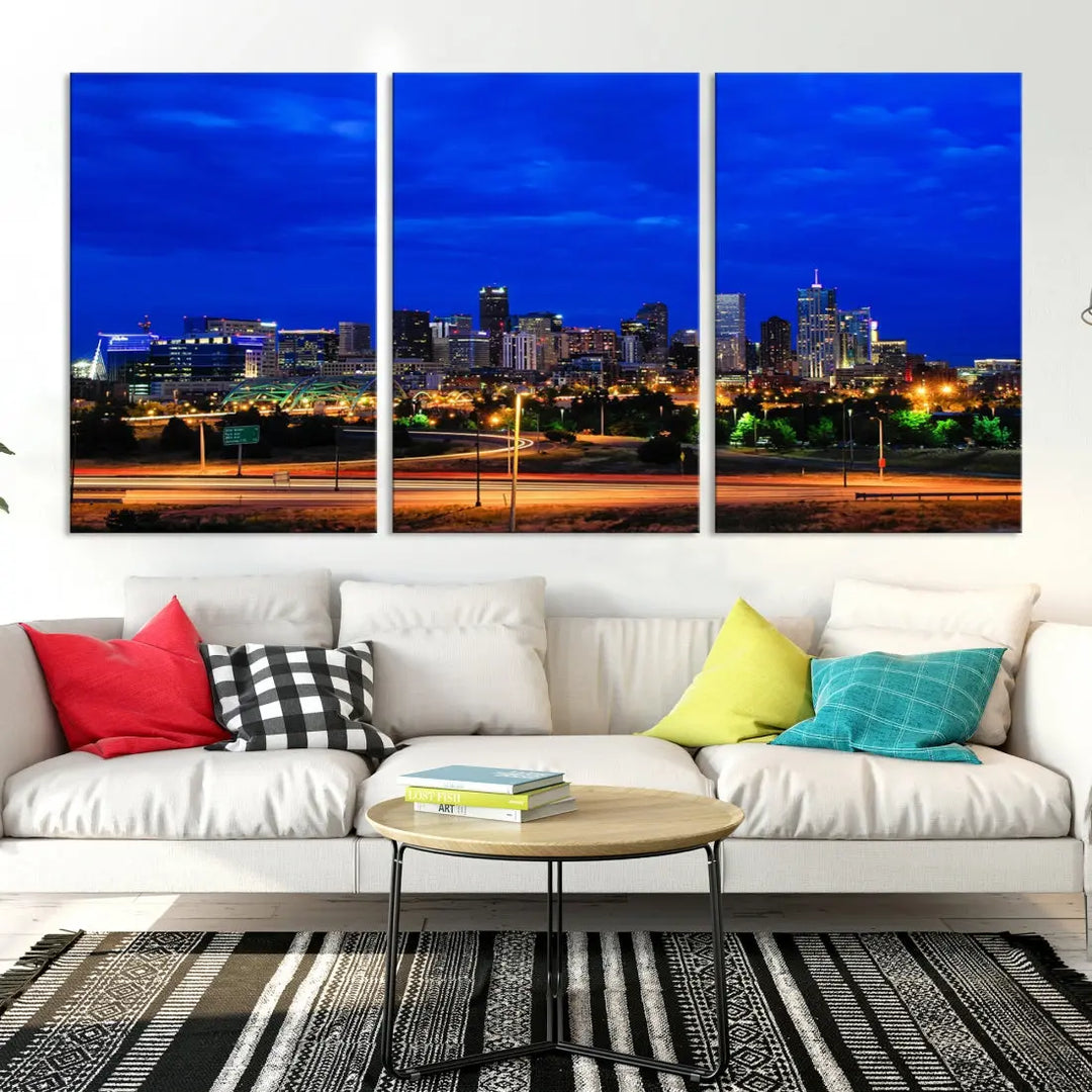 An inviting room features the "Dallas City Lights Night Bright Blue Skyline Cityscape View Wall Art Canvas Print," elegantly suspended and basking in soft lighting.