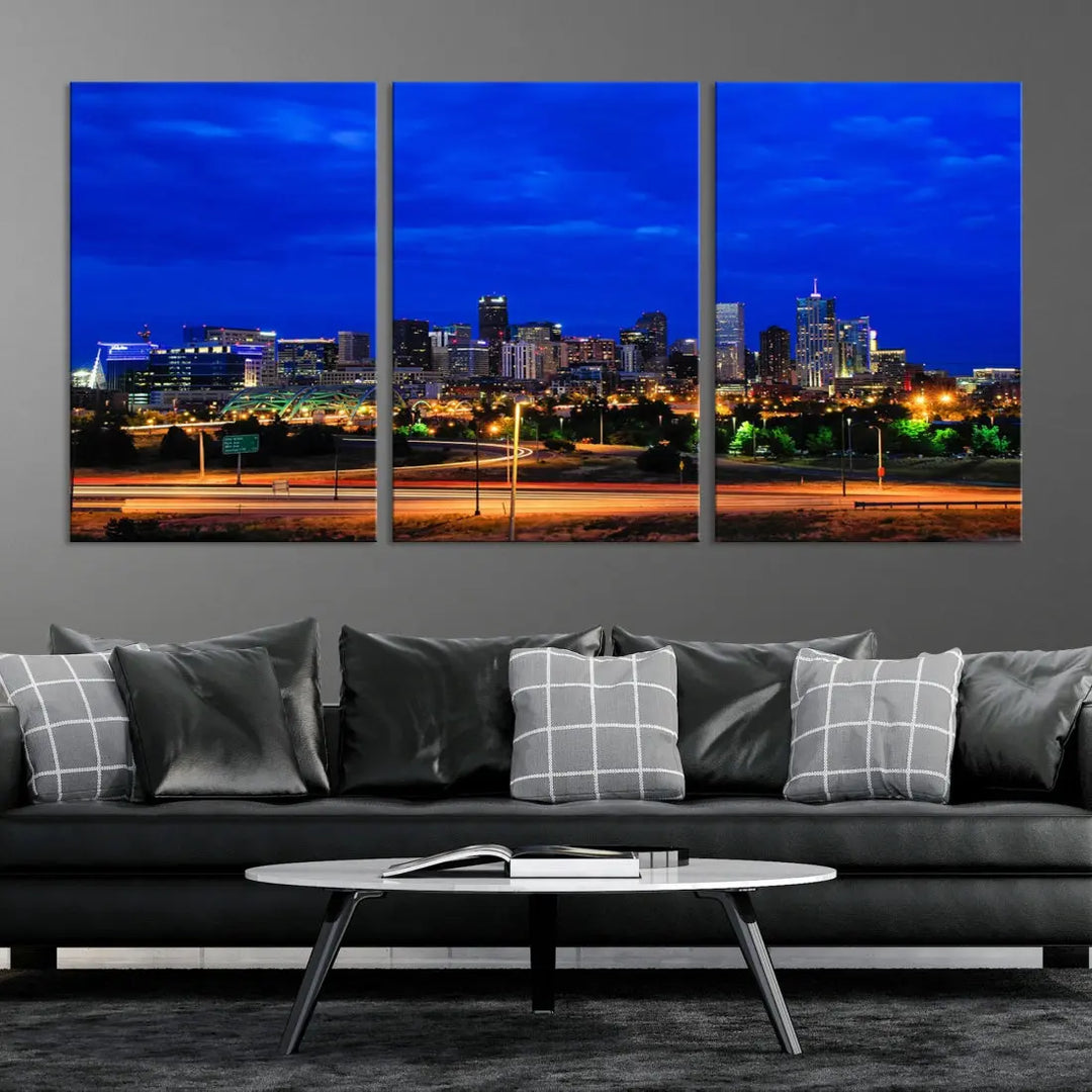 An inviting room features the "Dallas City Lights Night Bright Blue Skyline Cityscape View Wall Art Canvas Print," elegantly suspended and basking in soft lighting.