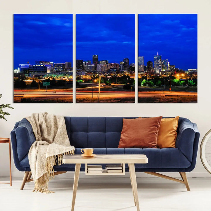 An inviting room features the "Dallas City Lights Night Bright Blue Skyline Cityscape View Wall Art Canvas Print," elegantly suspended and basking in soft lighting.