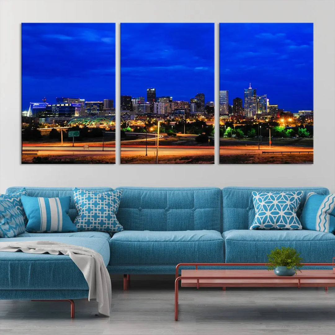 An inviting room features the "Dallas City Lights Night Bright Blue Skyline Cityscape View Wall Art Canvas Print," elegantly suspended and basking in soft lighting.