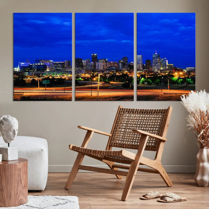 An inviting room features the "Dallas City Lights Night Bright Blue Skyline Cityscape View Wall Art Canvas Print," elegantly suspended and basking in soft lighting.