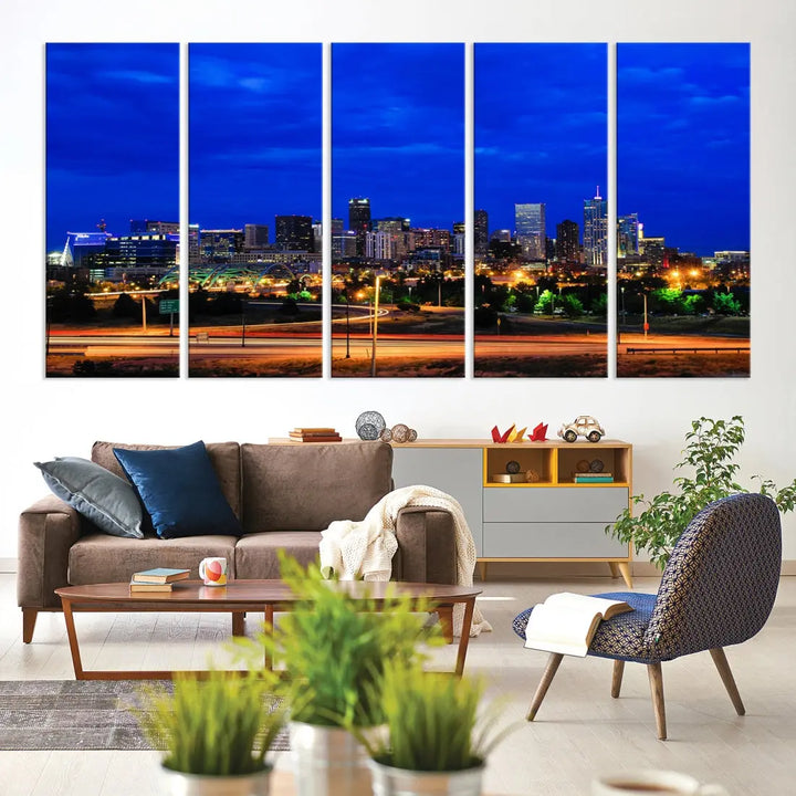 An inviting room features the "Dallas City Lights Night Bright Blue Skyline Cityscape View Wall Art Canvas Print," elegantly suspended and basking in soft lighting.