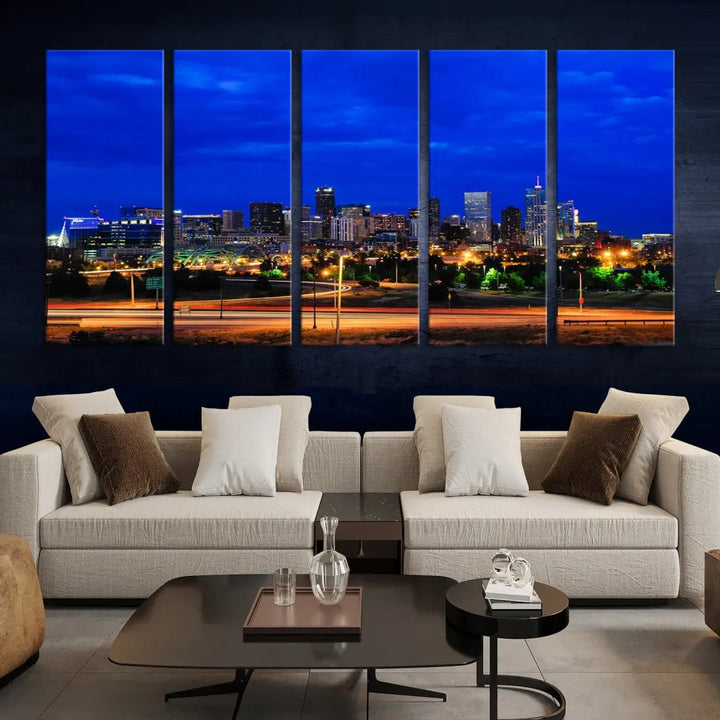 An inviting room features the "Dallas City Lights Night Bright Blue Skyline Cityscape View Wall Art Canvas Print," elegantly suspended and basking in soft lighting.