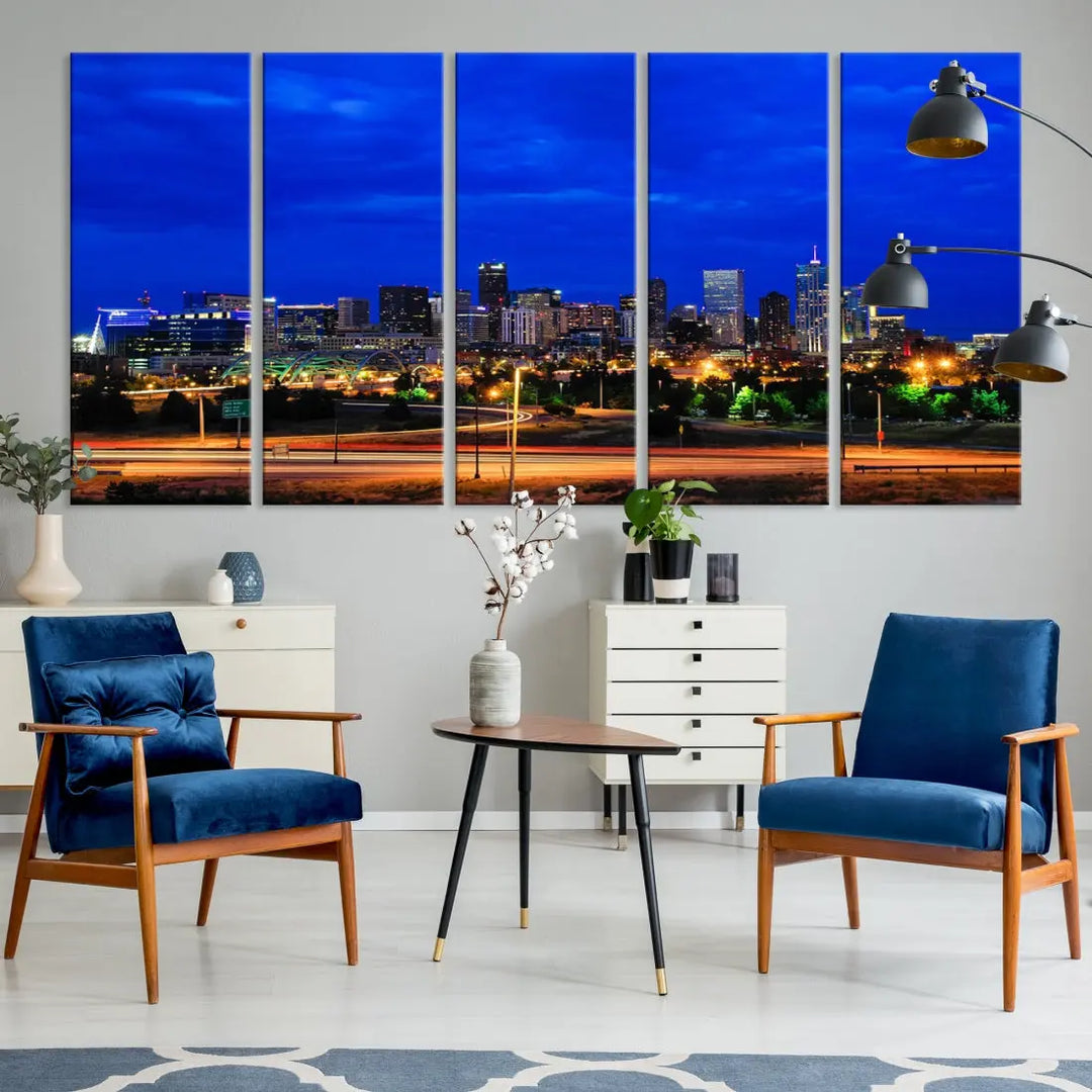 An inviting room features the "Dallas City Lights Night Bright Blue Skyline Cityscape View Wall Art Canvas Print," elegantly suspended and basking in soft lighting.