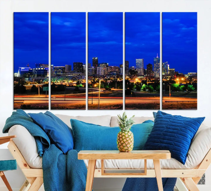 An inviting room features the "Dallas City Lights Night Bright Blue Skyline Cityscape View Wall Art Canvas Print," elegantly suspended and basking in soft lighting.