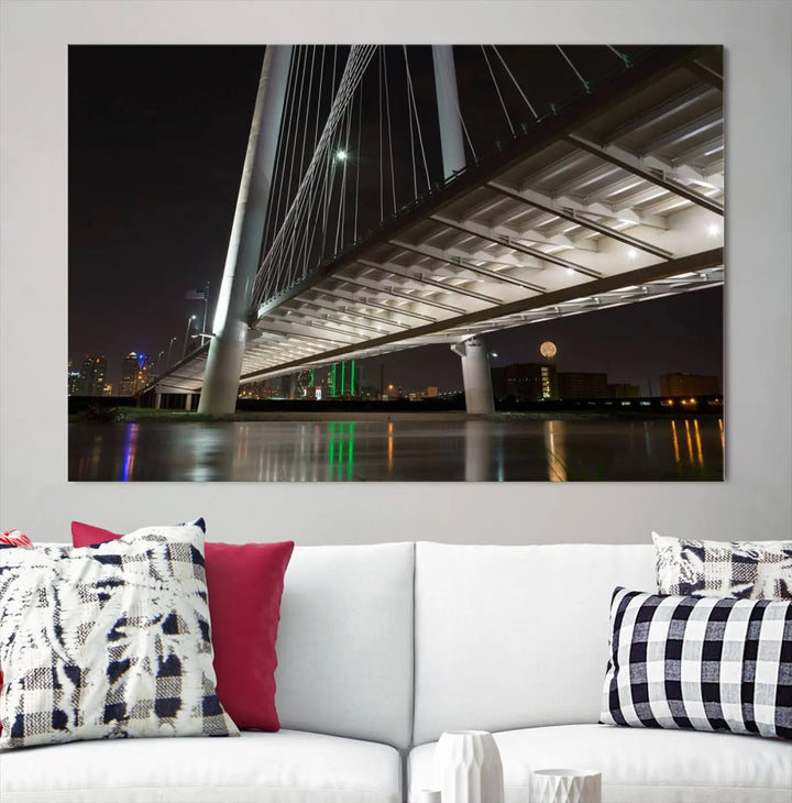 A modern living room showcases the "Dallas City Lights" night skyline cityscape as a triptych on museum-quality canvas. Enjoy the art's longevity with its UV-protective coating, all available with free shipping.